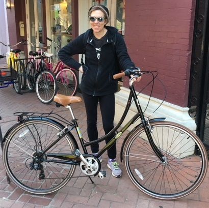A RideTHISbike customer with her new EVO Classic step-through bicycle.
