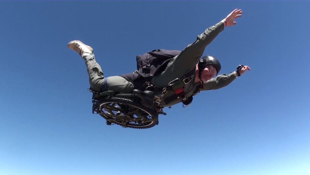 A parachuter freefalling with a Montague Paratrooper folding bike .