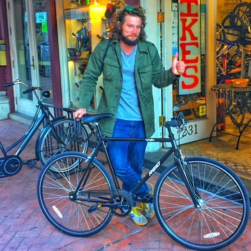 A happy Reid bicycle customer with his new city bike.