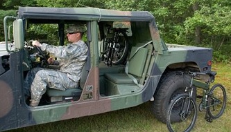 Original Montague Paratrooper folding bikes and a Humvee